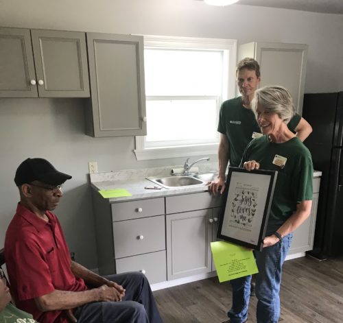Mr Willie presented with a wall hanging for his kitchen