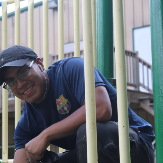 David painting the Tall Pines playground.