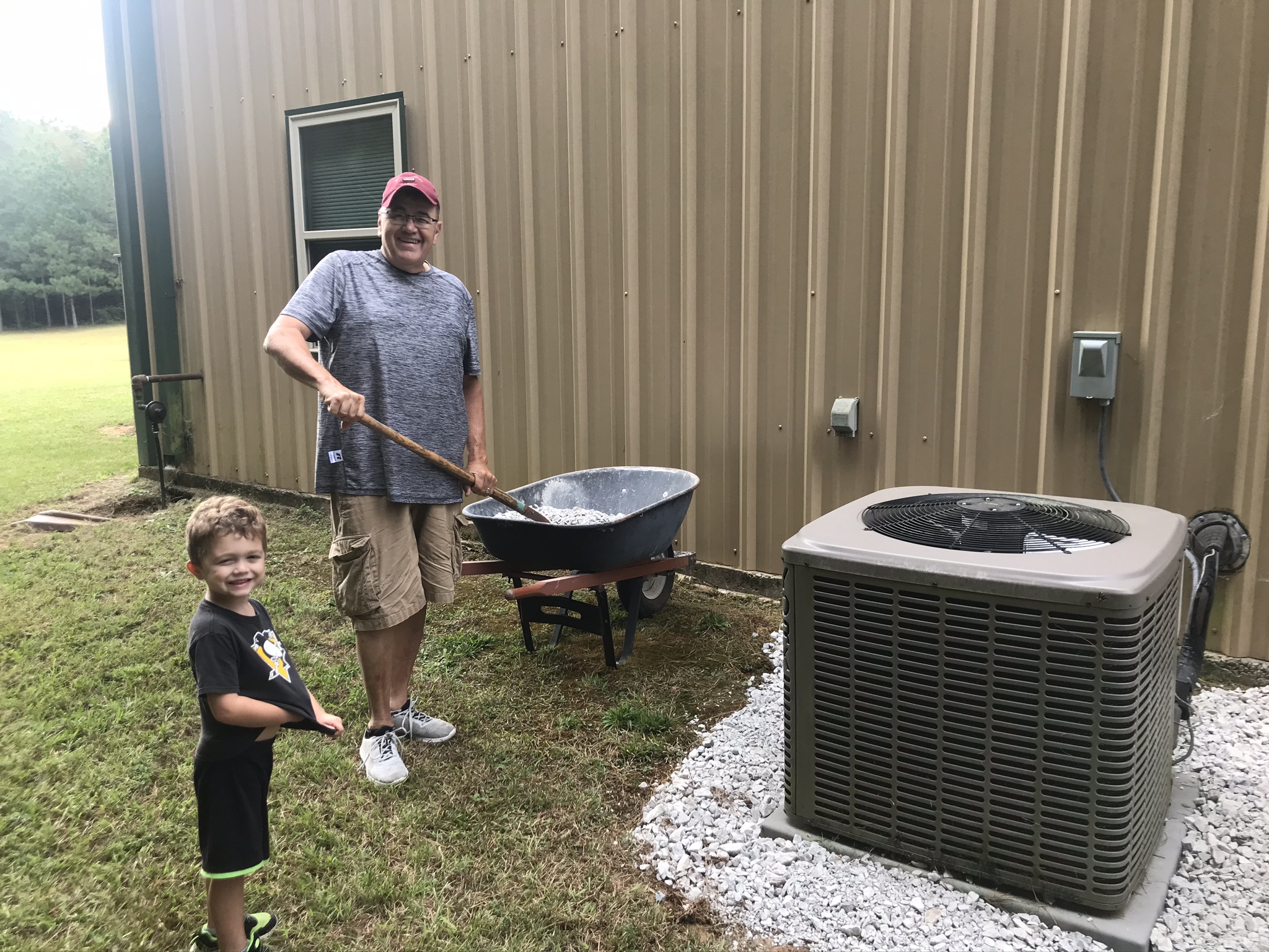 Keith "Pap" Graybill and grandson Ian spreading gravel