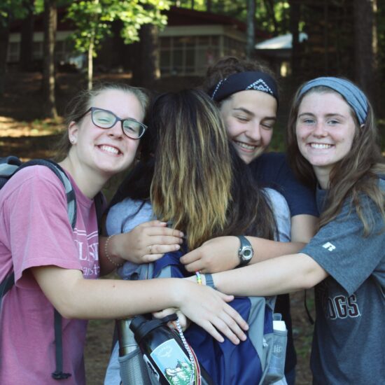 "Camper making friends during phone-free week at Christian summer camp"